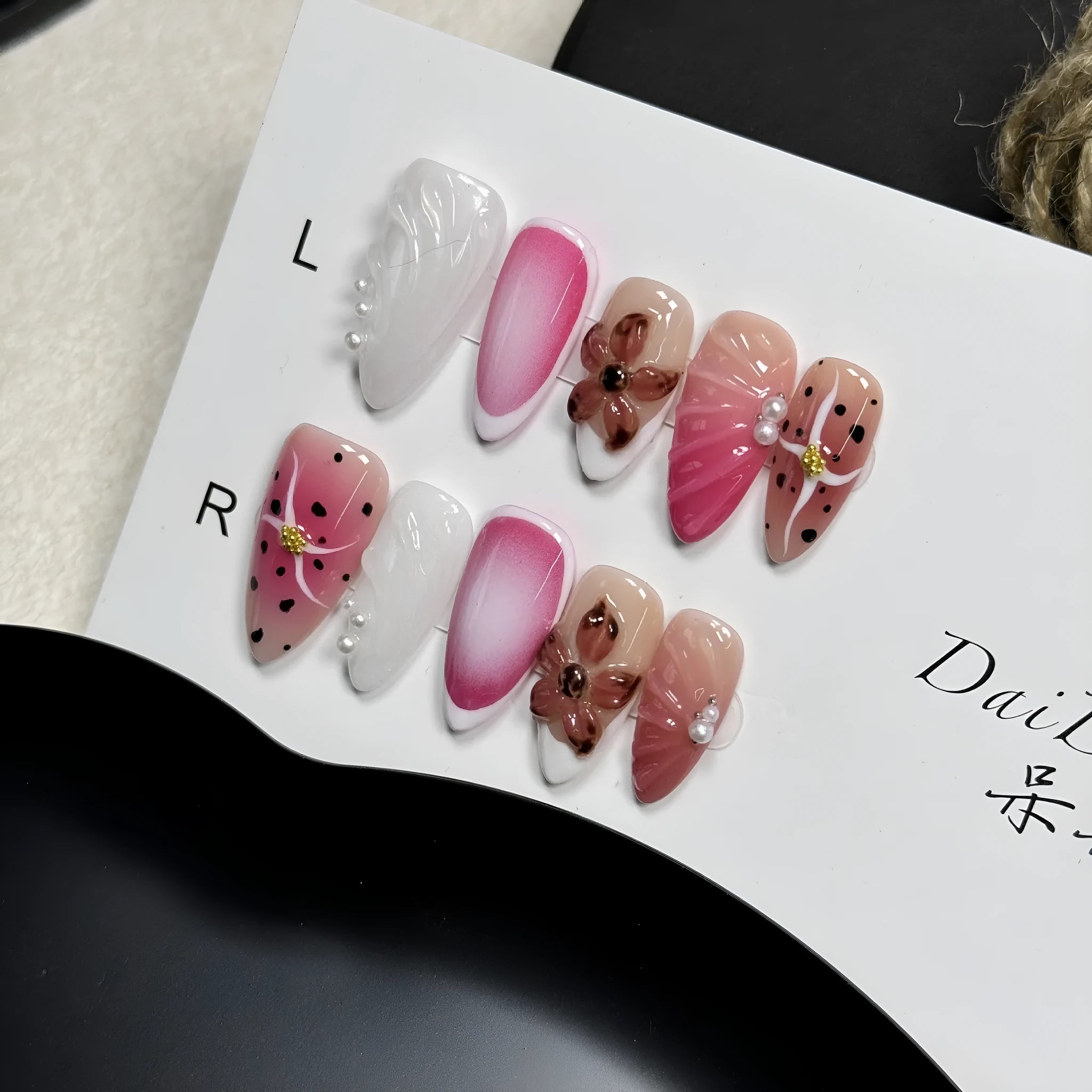 Hand-painted 3D carved nail beauty patches in candy and retro designs on almond-shaped plastic bases.