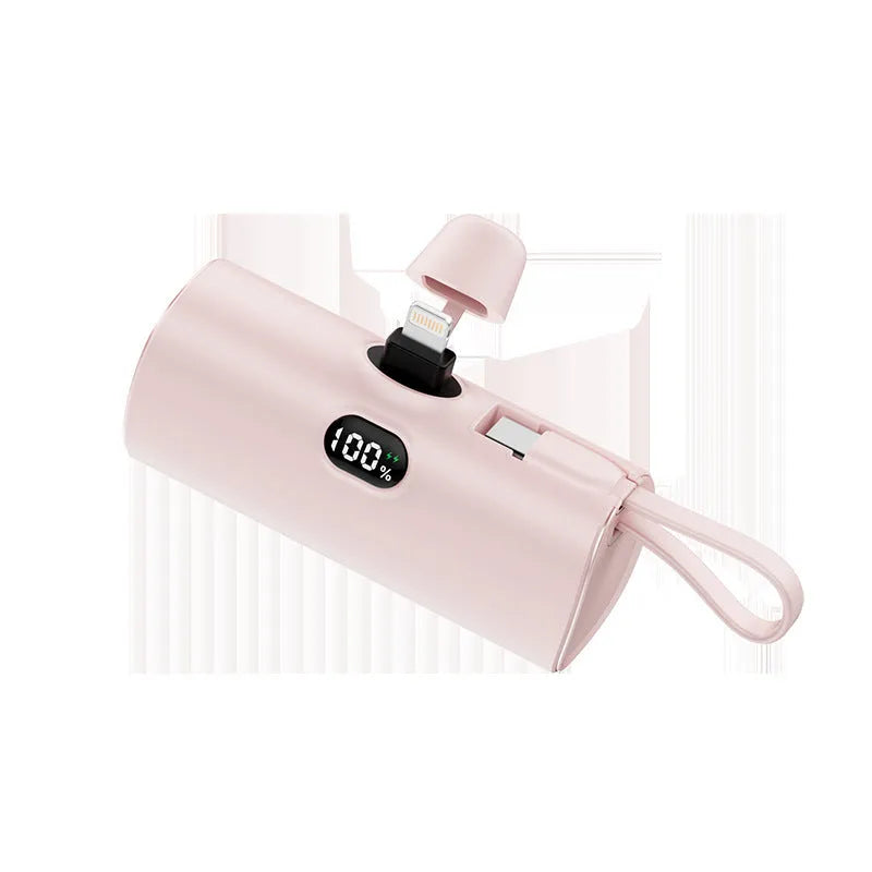 Compact wireless power bank with digital display showing battery percentage and built-in folding plug