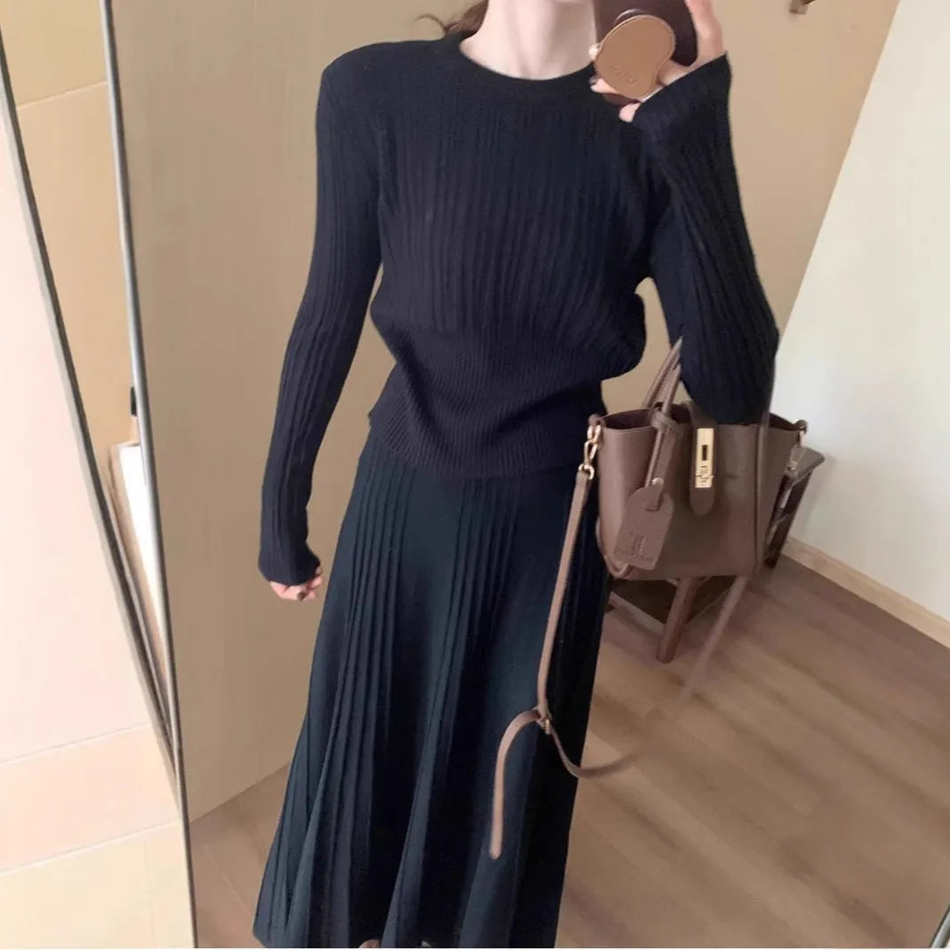 Dark grey knitted long dress suit with 3D pattern and collage stitching, shown with matching skirt.