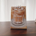 Mini 2025 desk calendar with simple modern design on a desk.