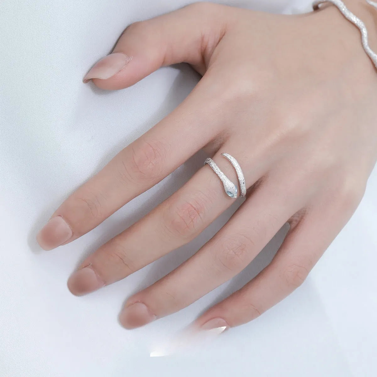 Adjustable opening silver electroplated snake design ring in platinum white gold colour for women