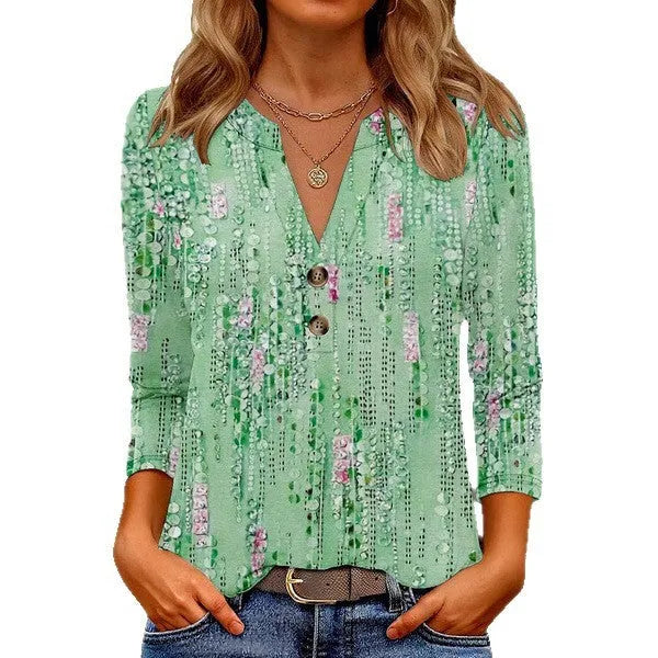 Women's loose fit V-neck t-shirt with a colourful 3D effect printed pattern on the front.