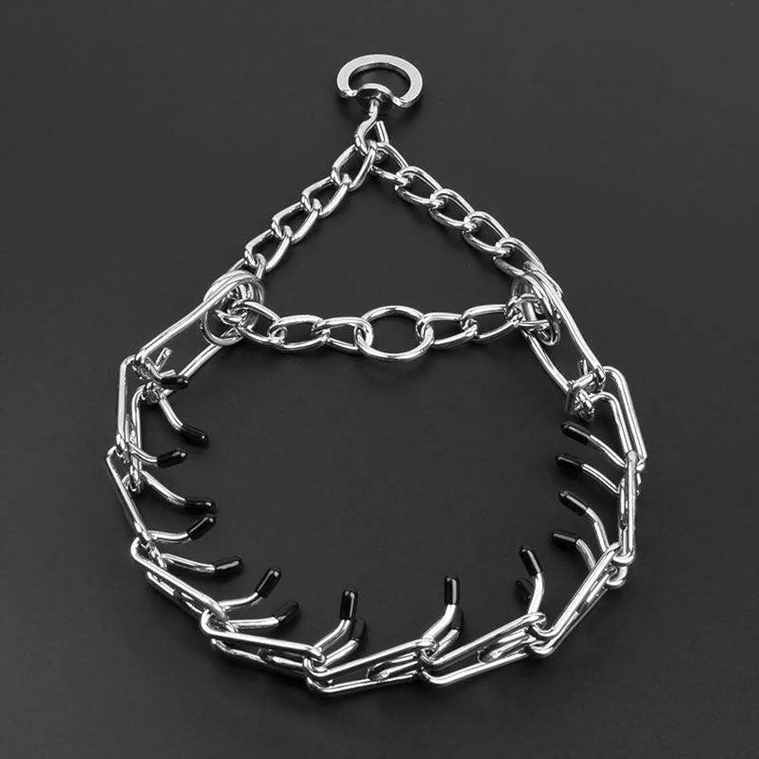 Stainless steel dog pinch training collar with round links and black rubber tips, shown on a size chart.