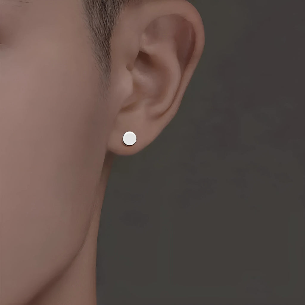 S999 sterling silver flat ear bone studs in round shape, showing silver and black colour options.
