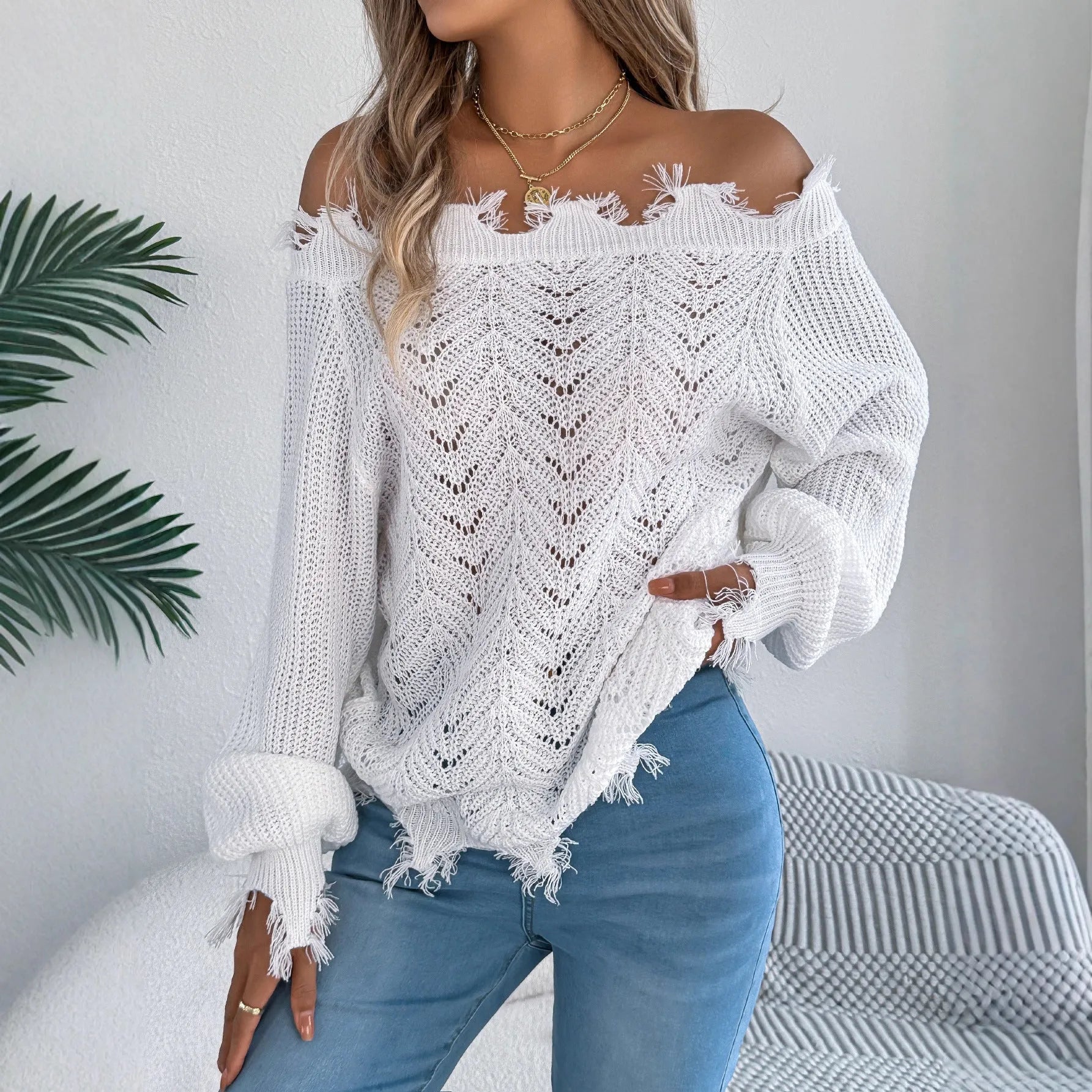 Hollow-out cut-off shoulder pullover sweater in artificial wool acrylic fabric showing street fashion styling