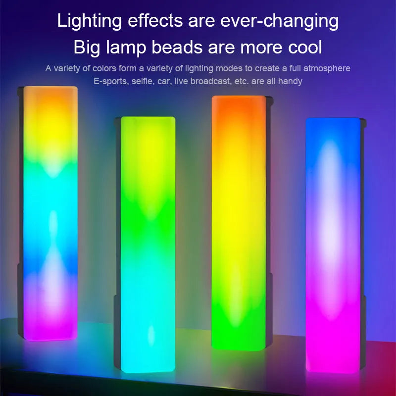 Black and white 3D RGB music rhythm ambiance lamp on a table with USB cable.