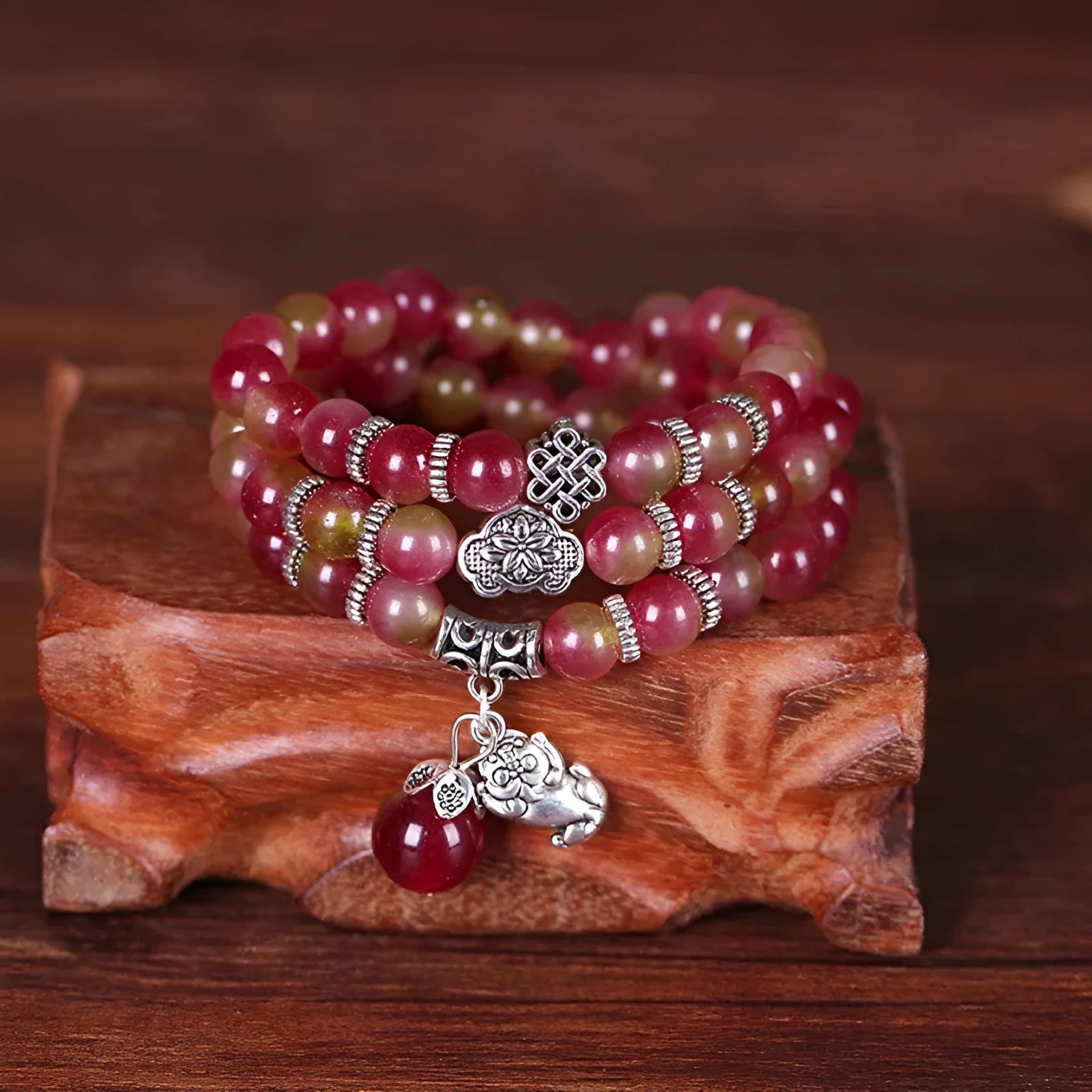 Natural watermelon crystal bracelet with Chinese knot fastening showing bi-colour gemstone beads