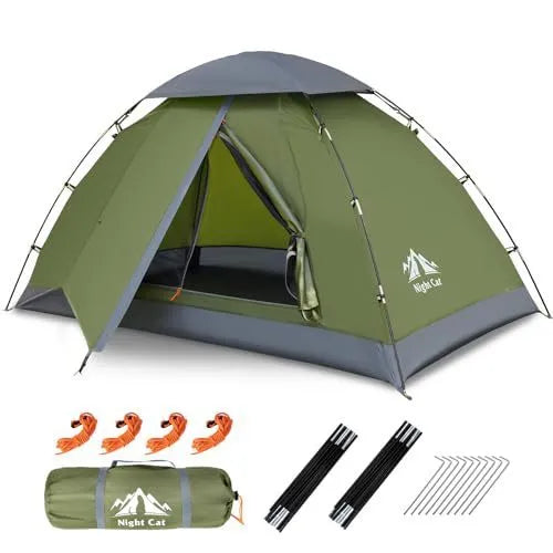 Dark green instant pop-up two-person camping tent shown pitched outdoors.