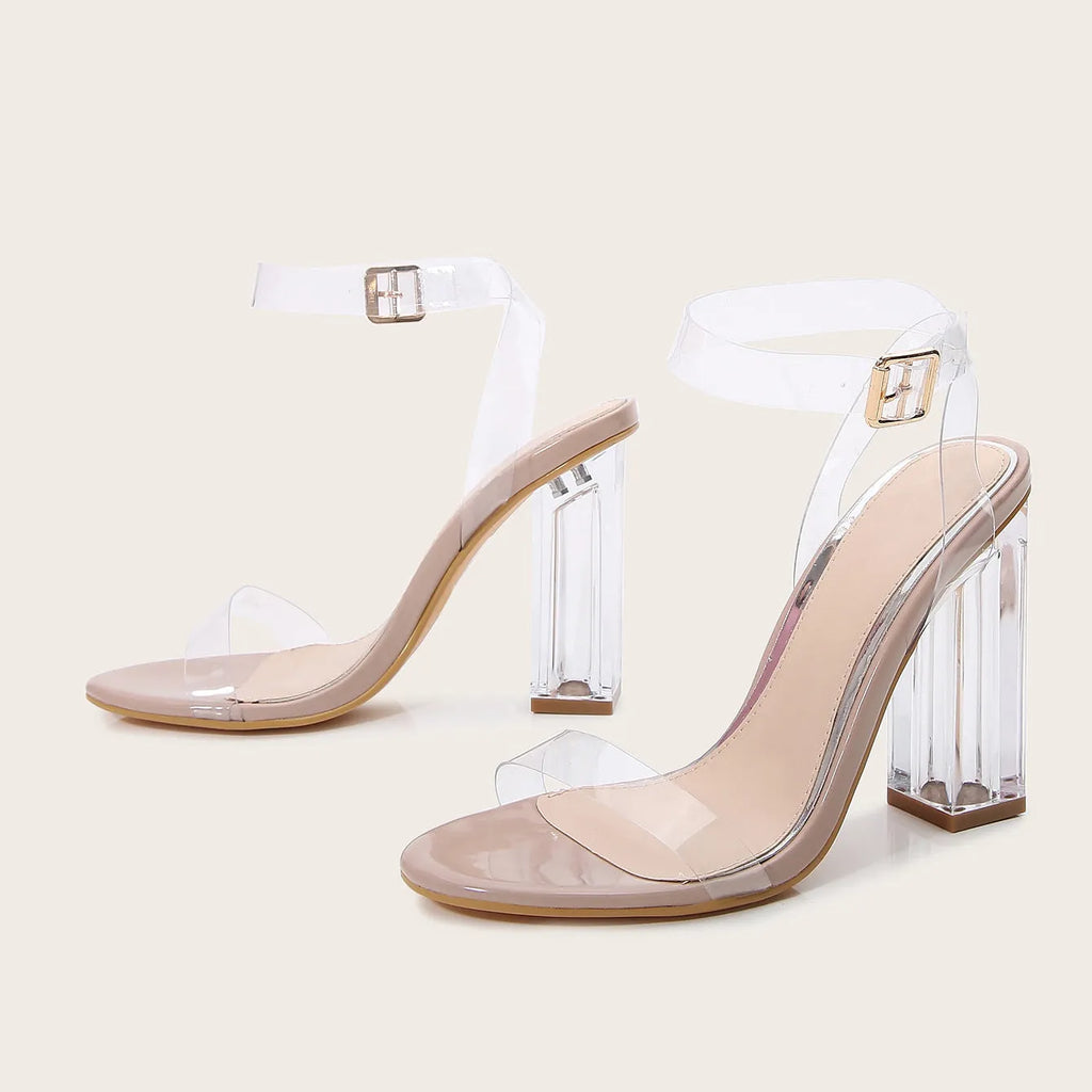 Women's apricot sandals with transparent glass heels and round toe design, showing buckle fastening