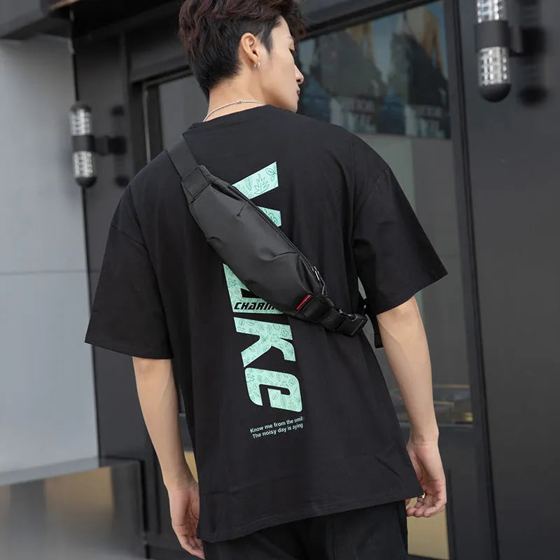 Black Oxford cloth waist pack with crossbody strap showing phone and ID pockets