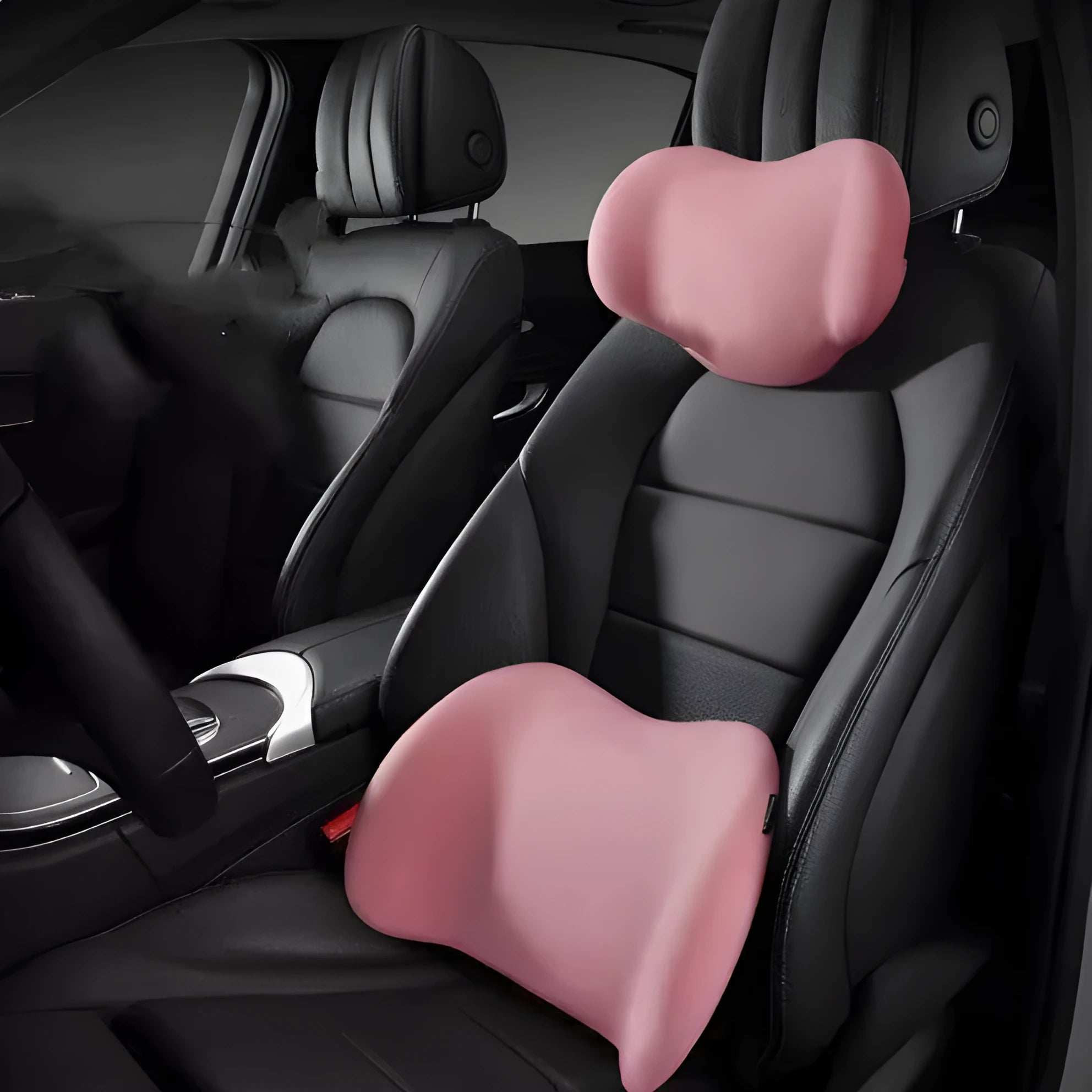 Black memory cotton car headrest and waist support cushion set on a car seat.