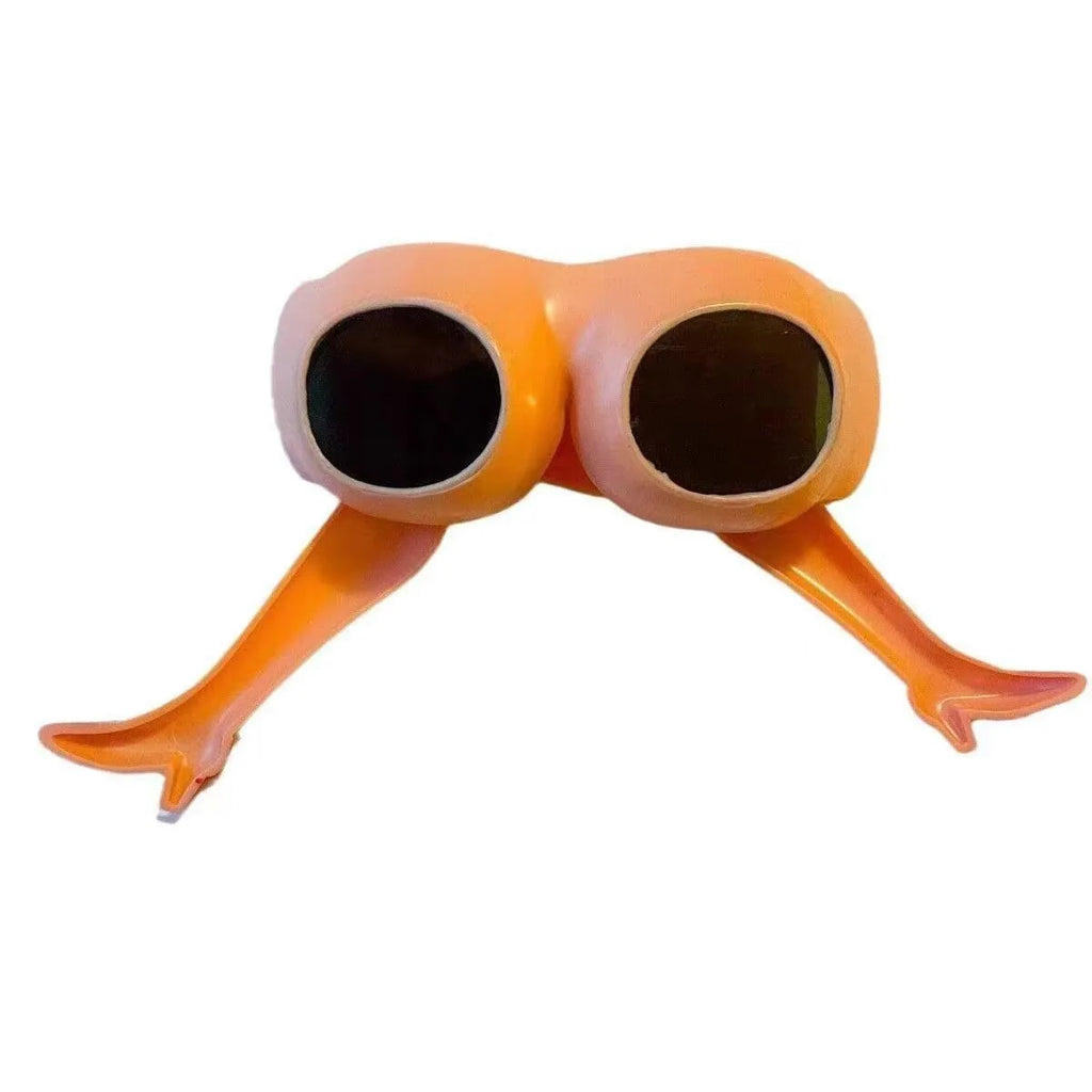 Orange novelty sunglasses with a leg and hip design on a white background.