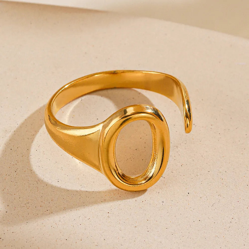 Oval ins style adjustable stainless steel ring in gold and steel colours on white background