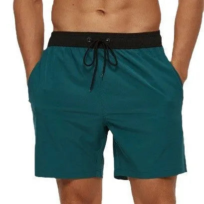 Men's blue stitching waist running shorts with a zippered pocket and drawstring.