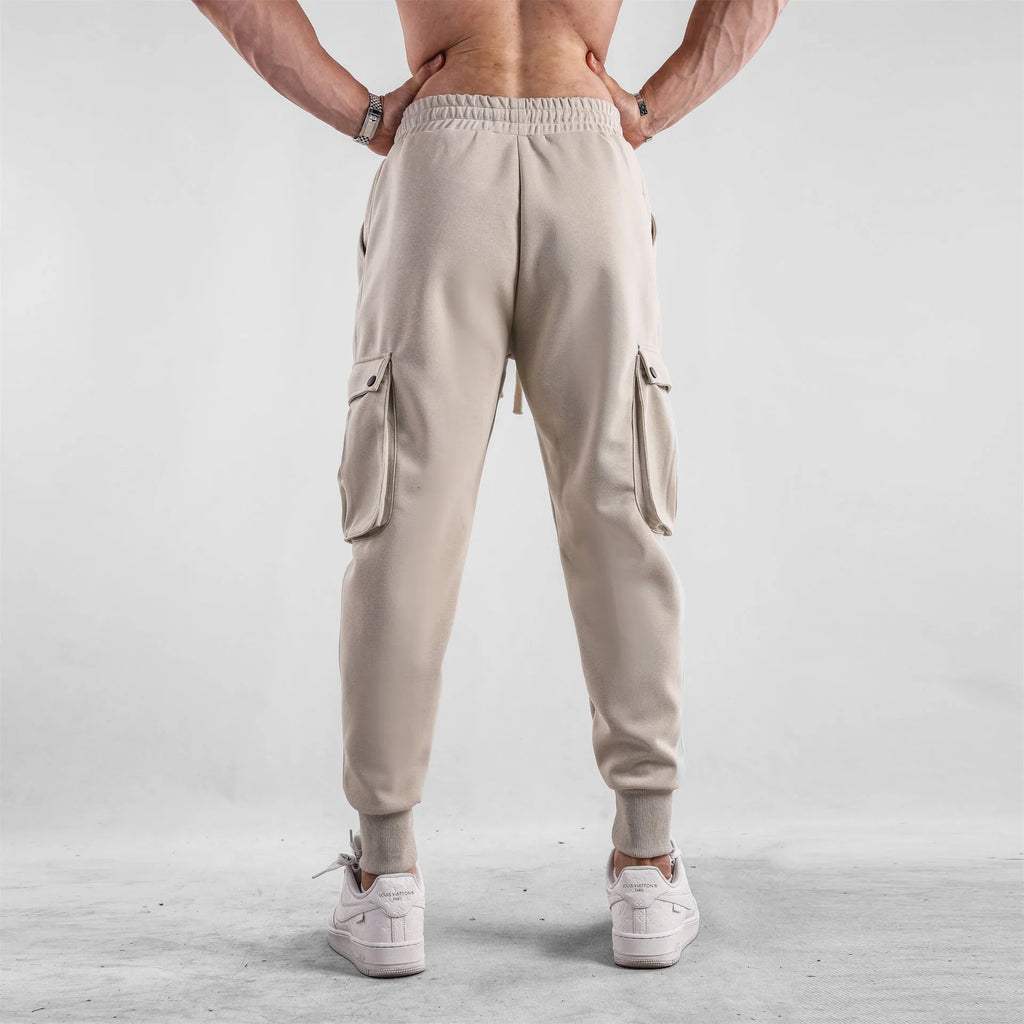 Men's loose fit cotton sports trousers with ankle tie detail and multiple pockets in various colour options