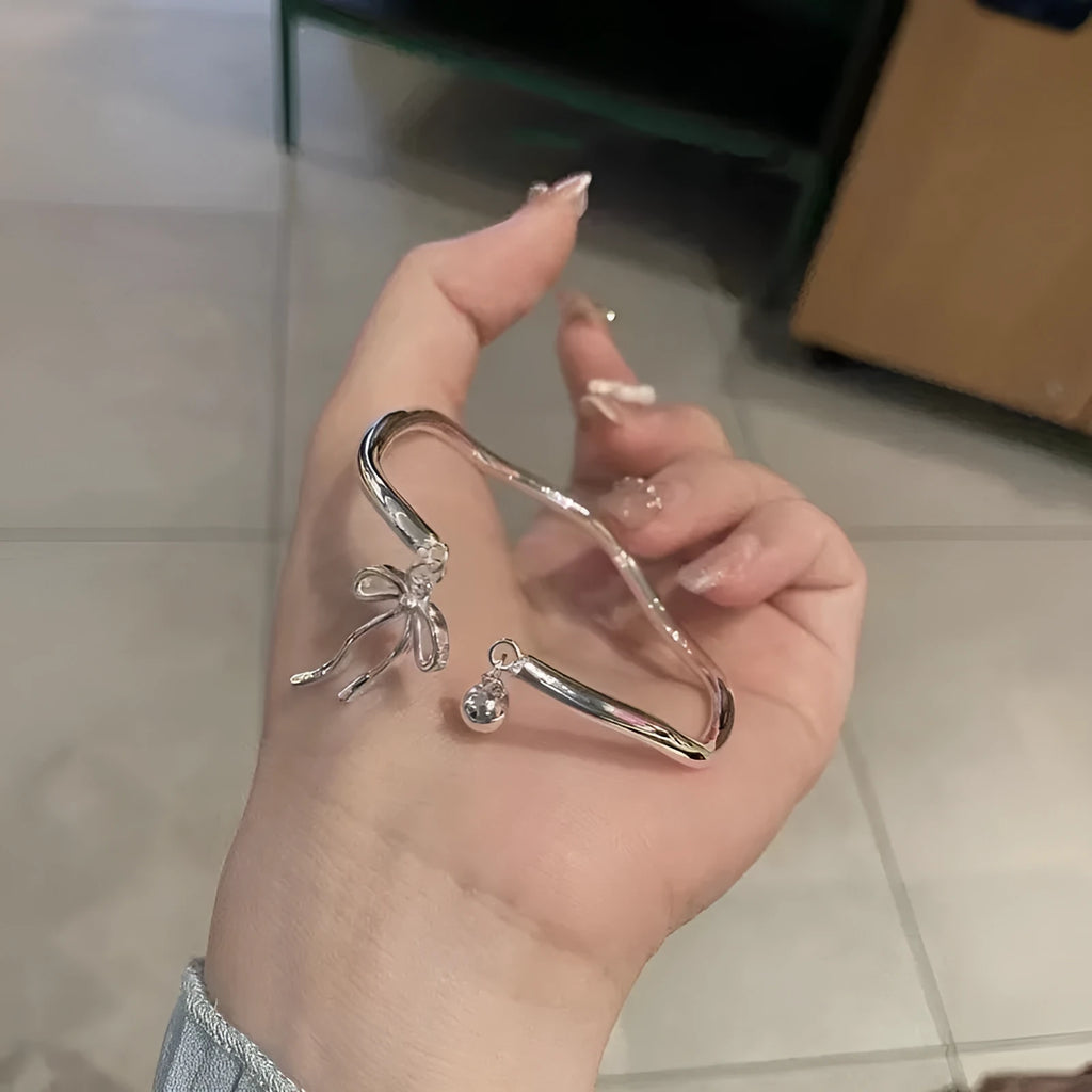 Silver bow adjustable bracelet with bell opening clasp on zinc alloy chain