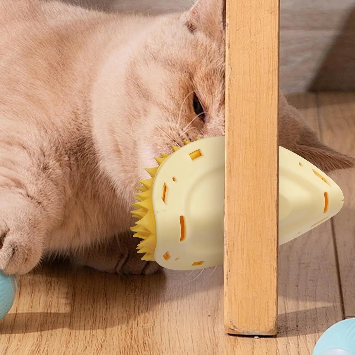 Yellow durian-shaped cat corner scratcher with built-in massage comb for wall corners