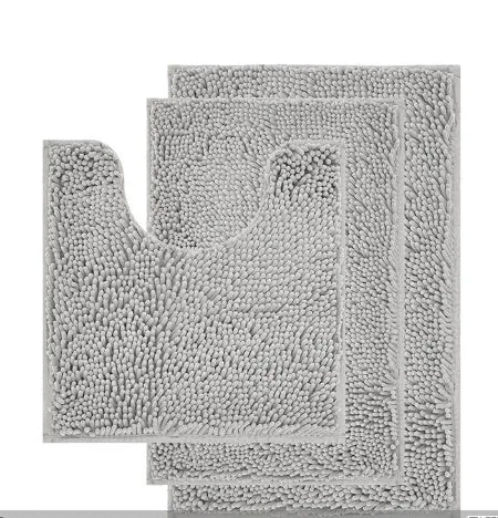Dark green chenille three-piece U-shaped toilet mat set with non-slip TPR backing on bathroom floor.