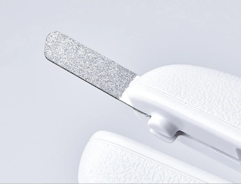 White pet nail clippers with built-in LED light and transparent anti-splash guard.