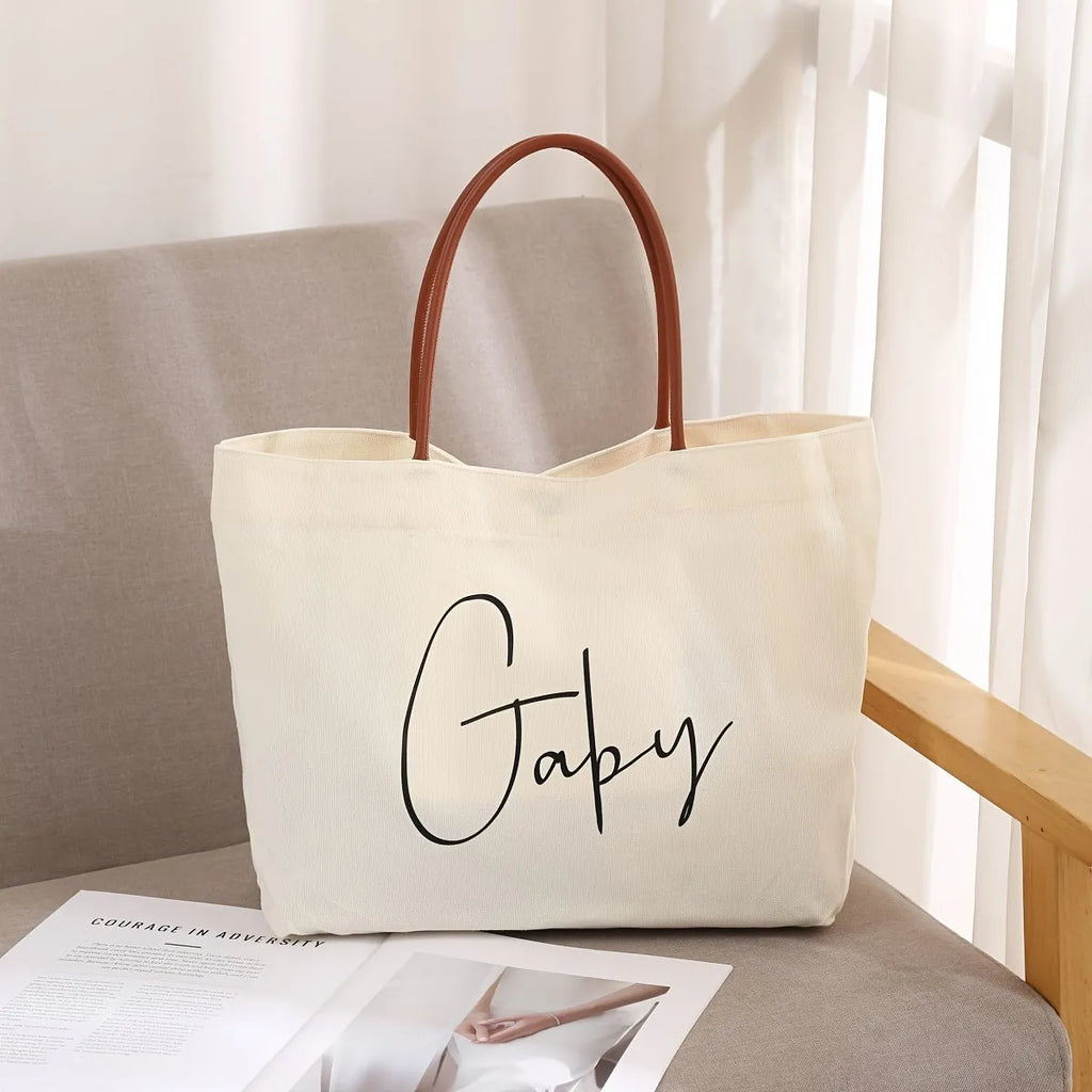 Beige white canvas tote bag with zip closure showing its spacious interior