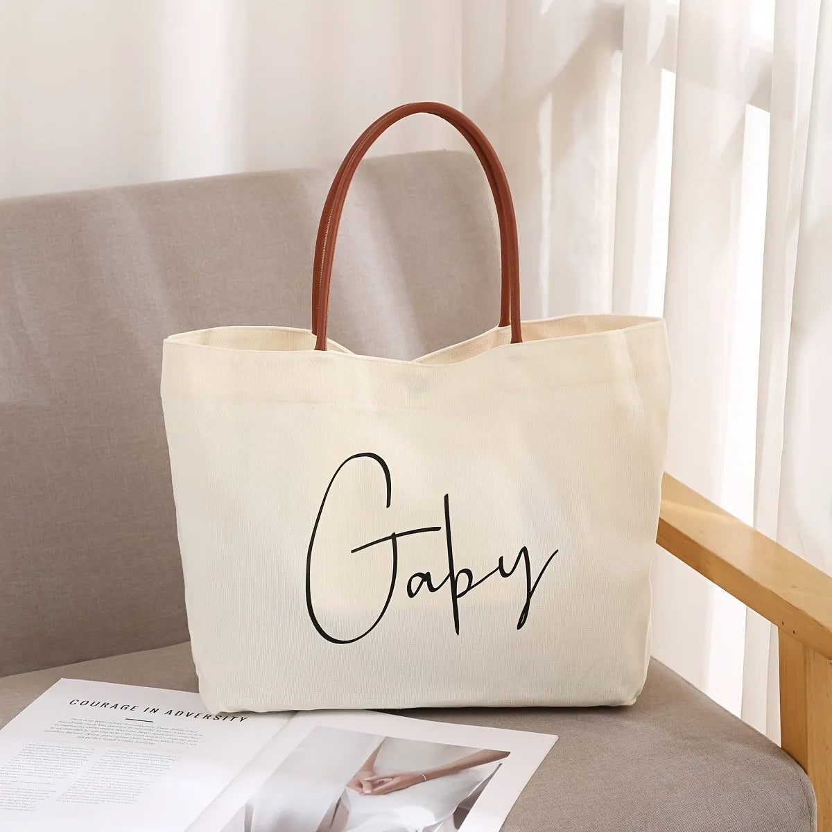 Beige white canvas tote bag with zip closure showing its spacious interior
