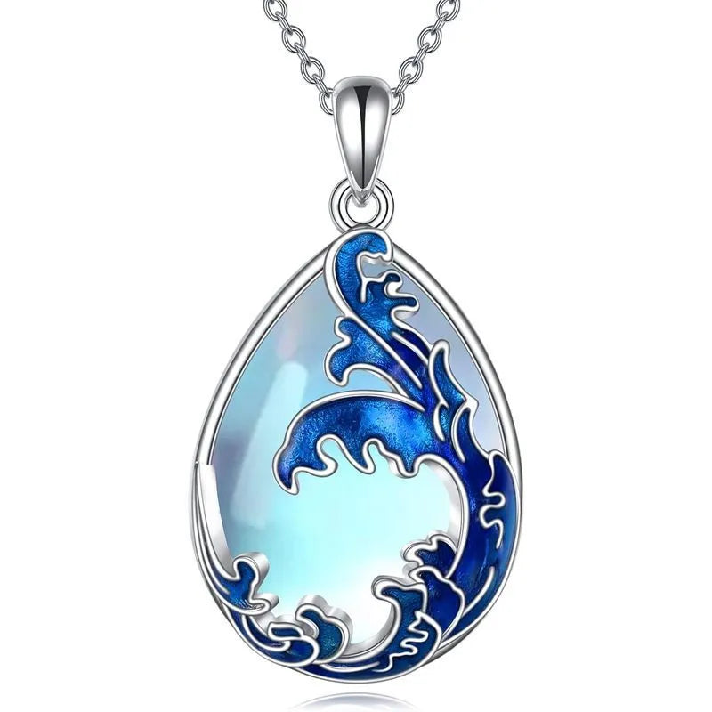 Blue alloy pendant necklace with heart design elements on included chain