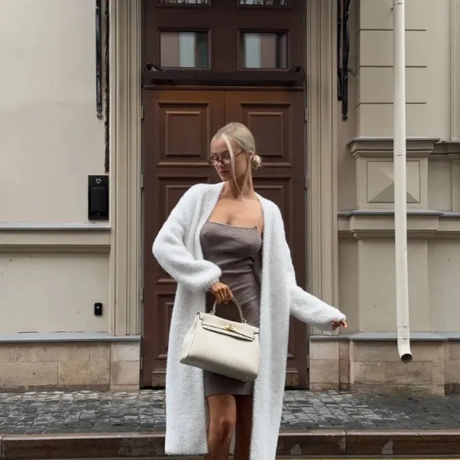 Women's white knitted cardigan jacket with extended length and loose fit