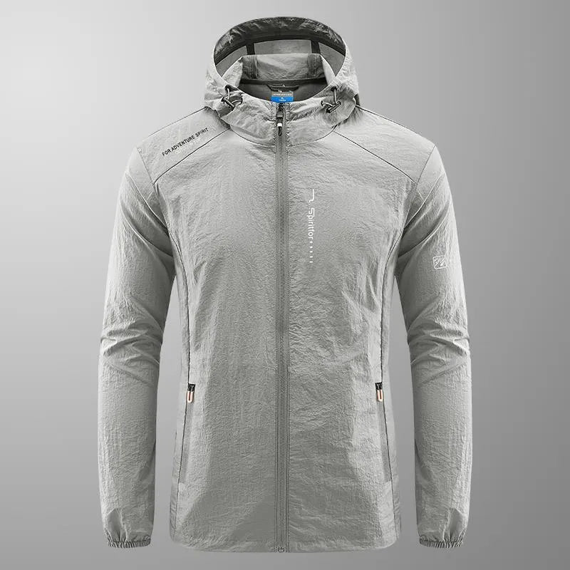 Man wearing a lightweight grey hooded nylon summer jacket for sun protection.