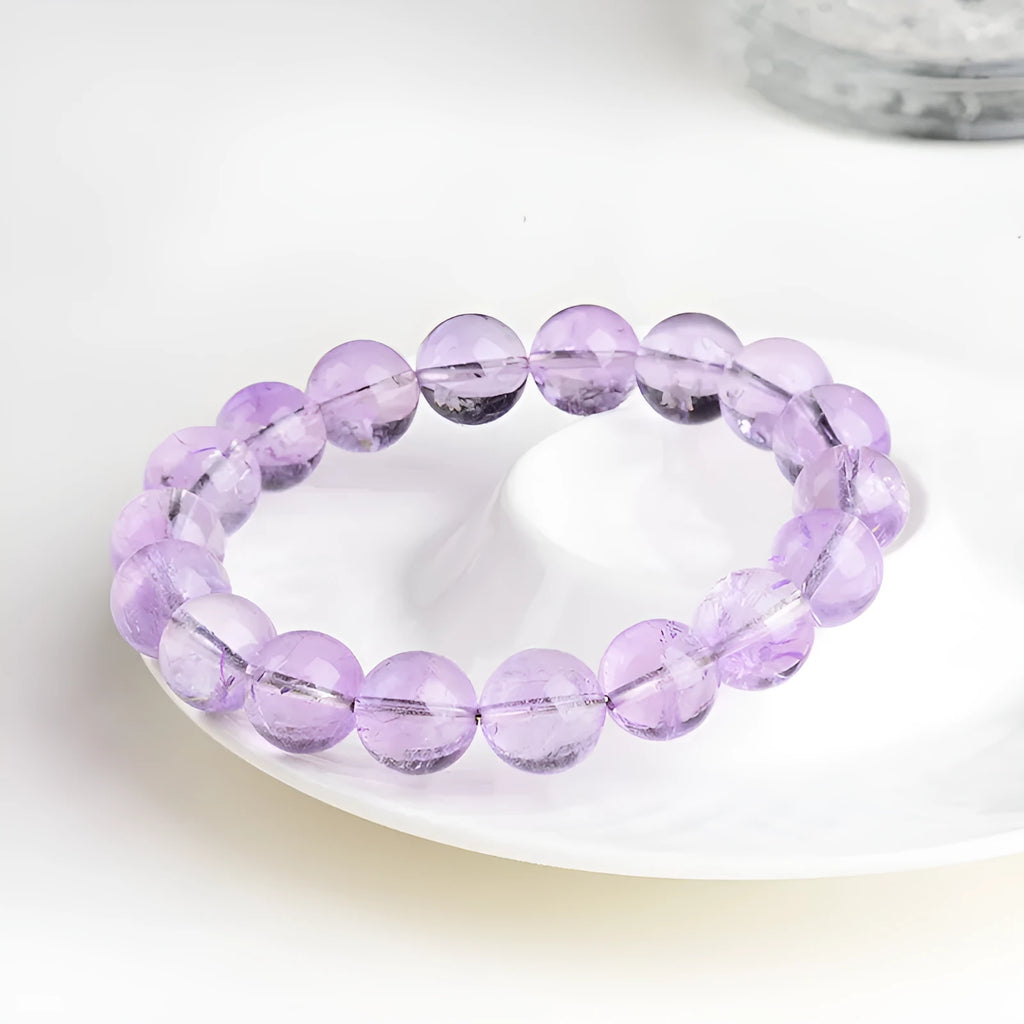 Lavender amethyst crystal bracelet with geometric round beads showing water ripple pattern