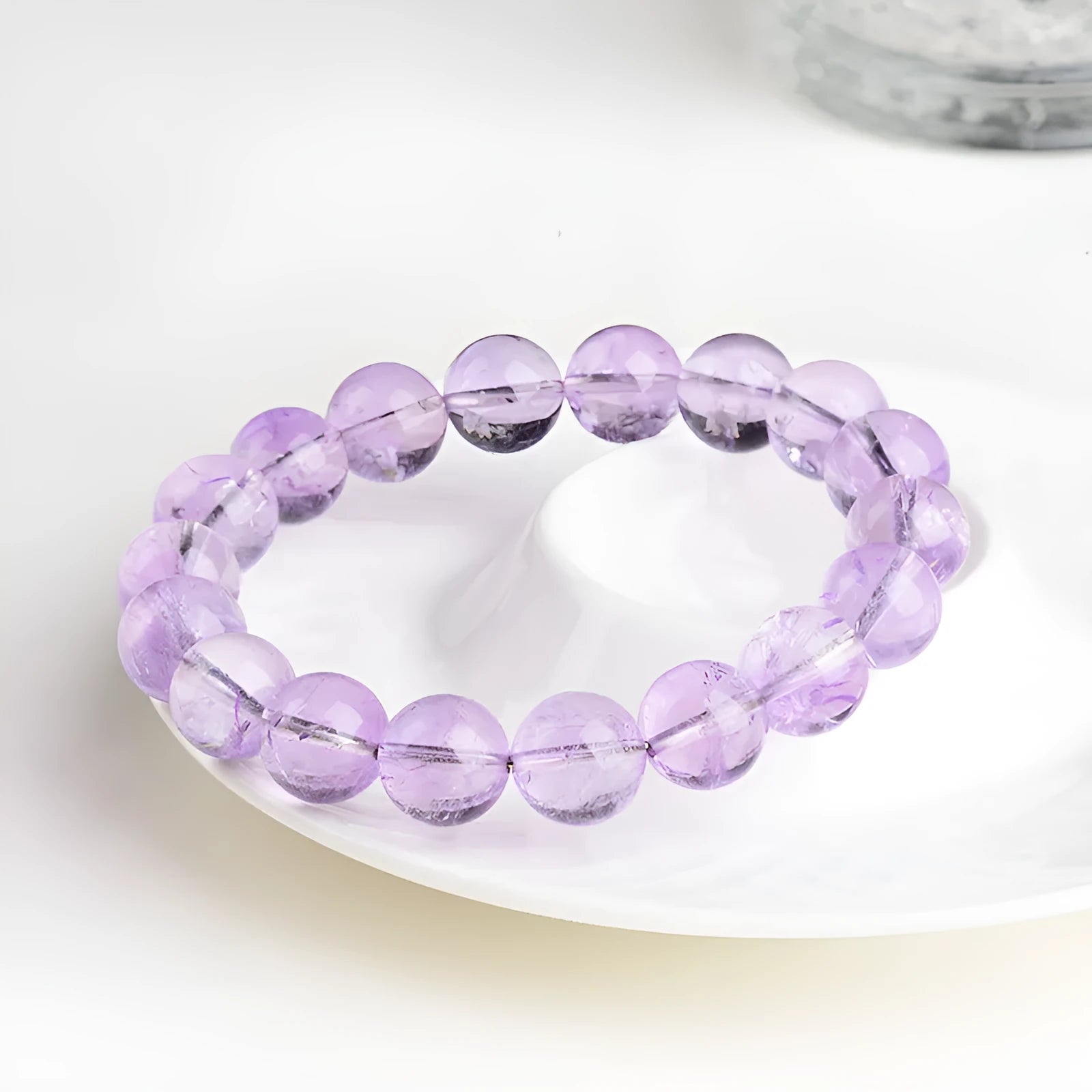 Lavender amethyst crystal bracelet with geometric round beads showing water ripple pattern