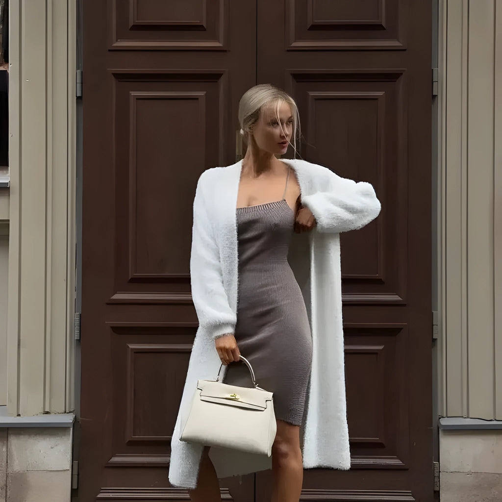 Women's white knitted cardigan jacket with extended length and loose fit