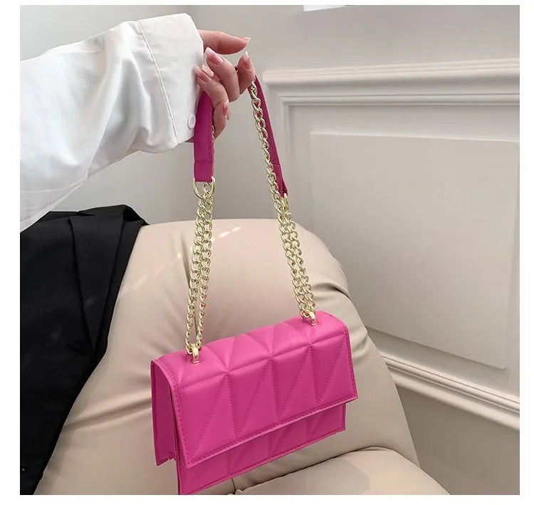 Small square PU chain crossbody bag in horizontal shape with spliced detail, available in five colours.
