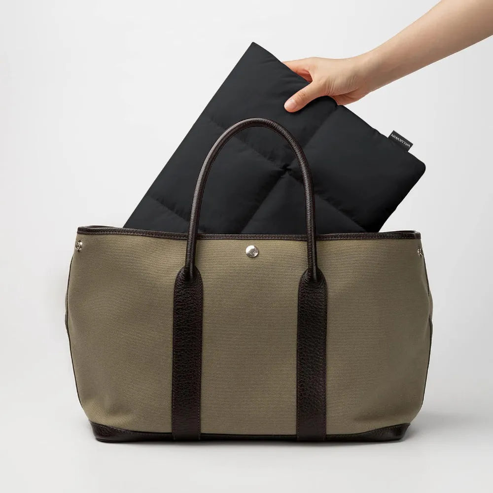 Soft polyester laptop sleeve in black or khaki with sewing thread detail, fitting 13-15.6 inch laptops