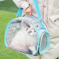 Large transparent hard EVA cat backpack carrier in grass green, shown with folded size.
