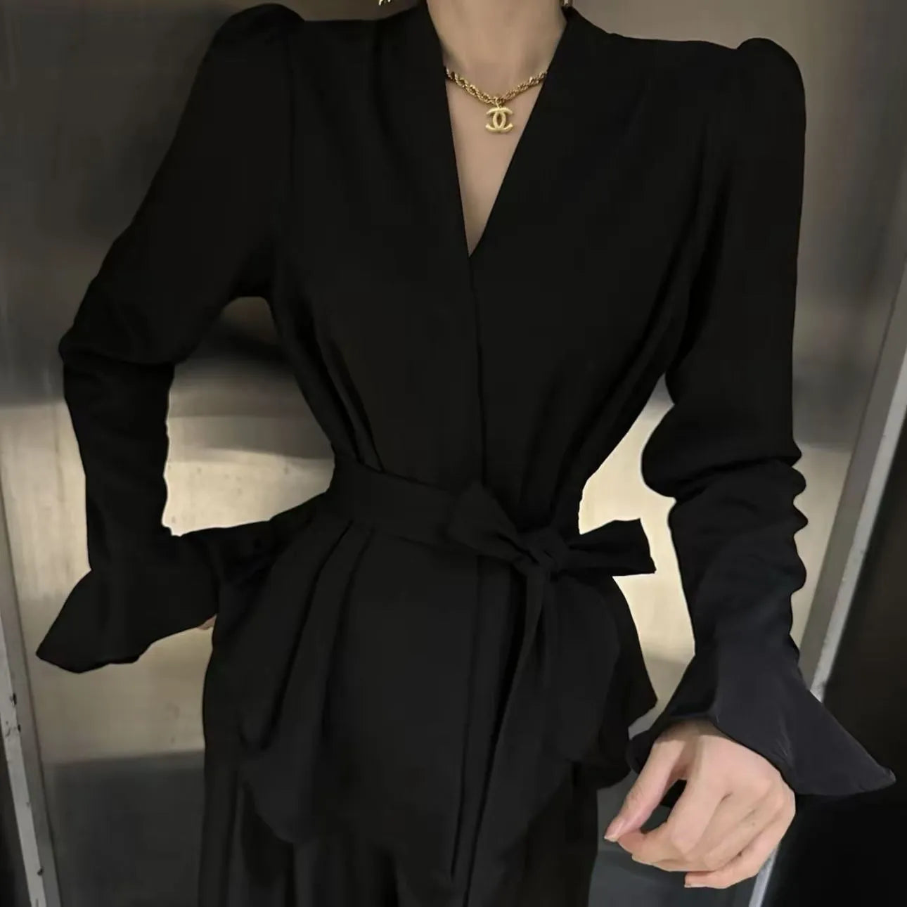 Women's French-style shirt with irregular collar and tied front in polyester fabric with bell sleeves