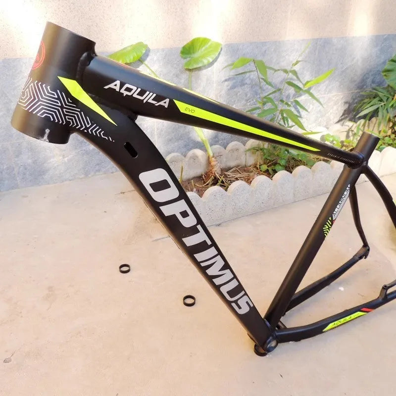 Black green 29-inch aluminium mountain bike frame with internal cable routing and disc brake mounts.