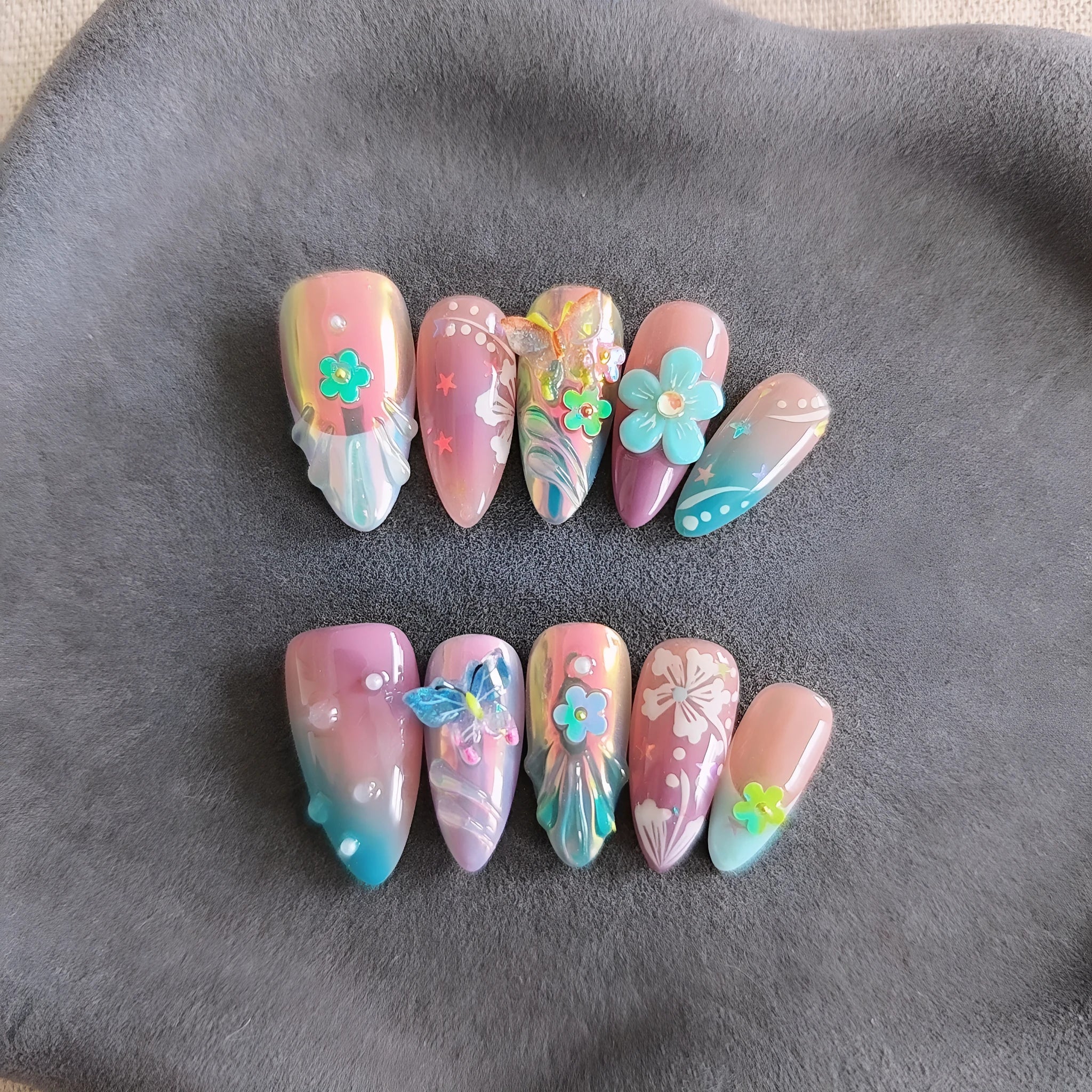 Handmade colourful small flower and butterfly sculpture manicure nails in floral patterns