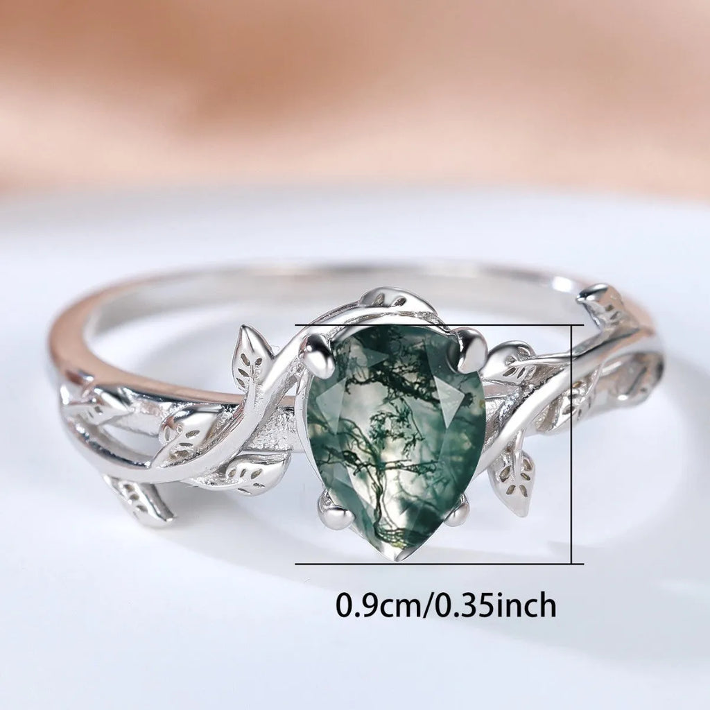 S925 silver drop-shaped agate edge branch leaf ring on white background, sterling silver band with natural stone