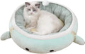 Green dinosaur-shaped cat bed shown both hanging as a hammock and laying flat as a sofa for small pets.