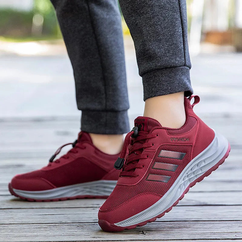 Breathable mesh casual shoes with elastic band closure in black, dark grey, purple and purplish red.