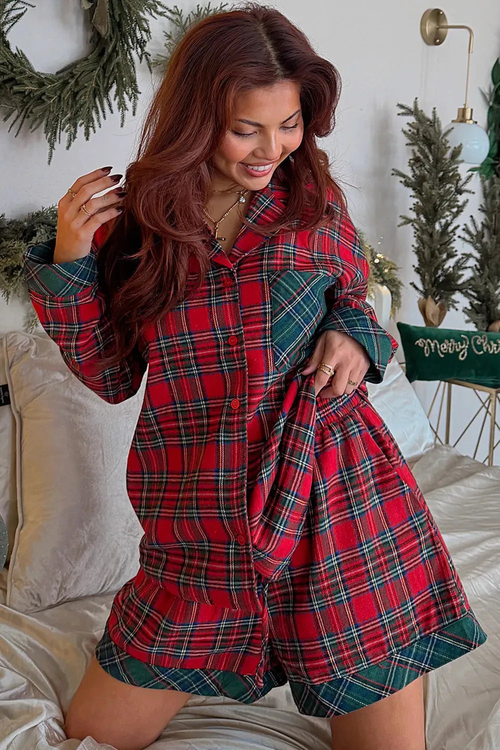 Red plaid Christmas pyjama set with long sleeve shirt and shorts featuring contrast patches