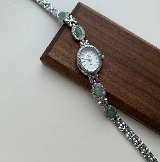 Green jade ladies quartz watch with silver case and white face