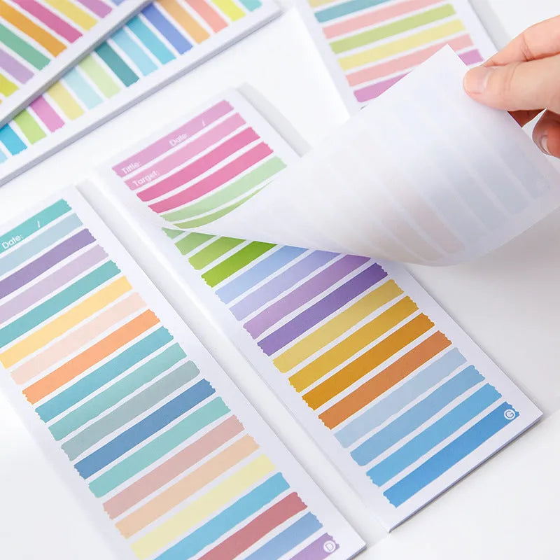 Student notepad with plastic storage box showing colourful striped and cartoon cover design options.
