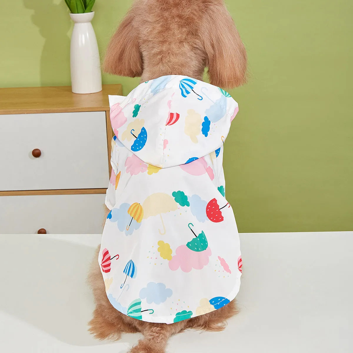 Colourful cartoon umbrella pattern dog raincoat or cat jacket in polyester.