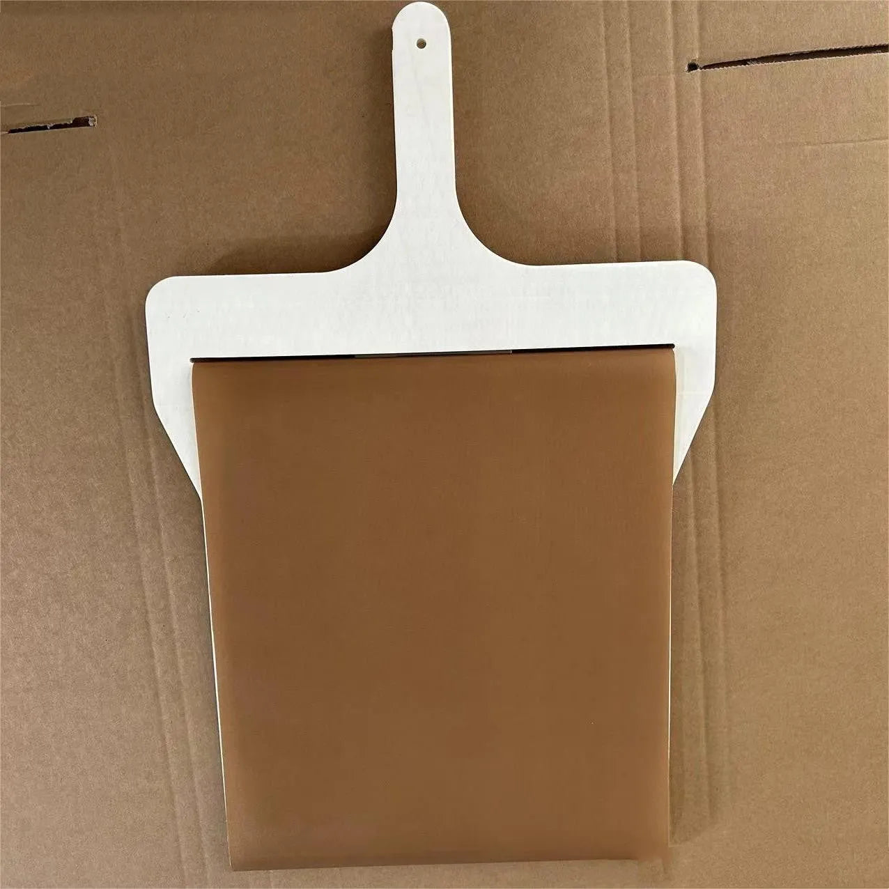 Natural wood sliding pizza peel in log colour with wooden handle, available in three sizes for transferring baked goods