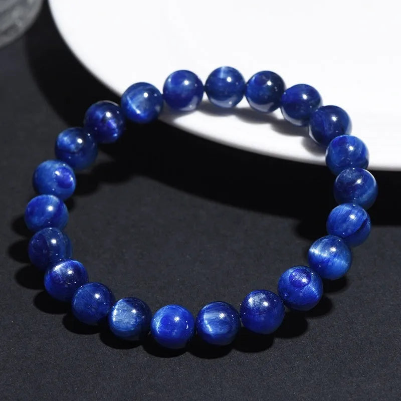 Blue crystal ball bracelet with geometric shape and Ruyi design elements on polished natural crystal