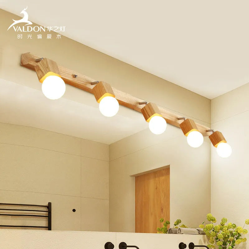 Single-head mirrored cabinet LED wall lamp with a 24cm size on a white wall.