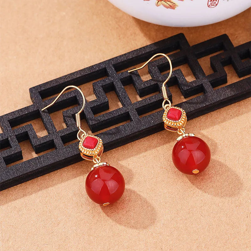 Geometric copper alloy earrings with round Southern red agate beads set in S925 silver.