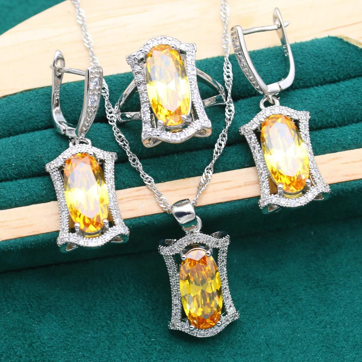 Anti-allergy zircon jewellery set with necklace, earrings, ring, and bracelet in yellow or olive colour.