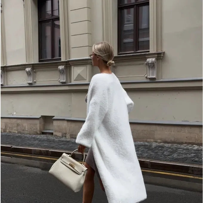 Women's white knitted cardigan jacket with extended length and loose fit